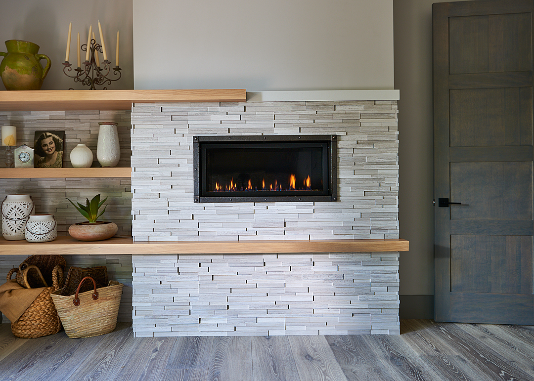 custom master bedroom fireplace with hand placed tile